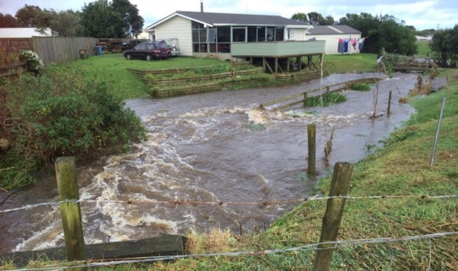 The Hihiwera Stream floods an Opunake property in 2015. 