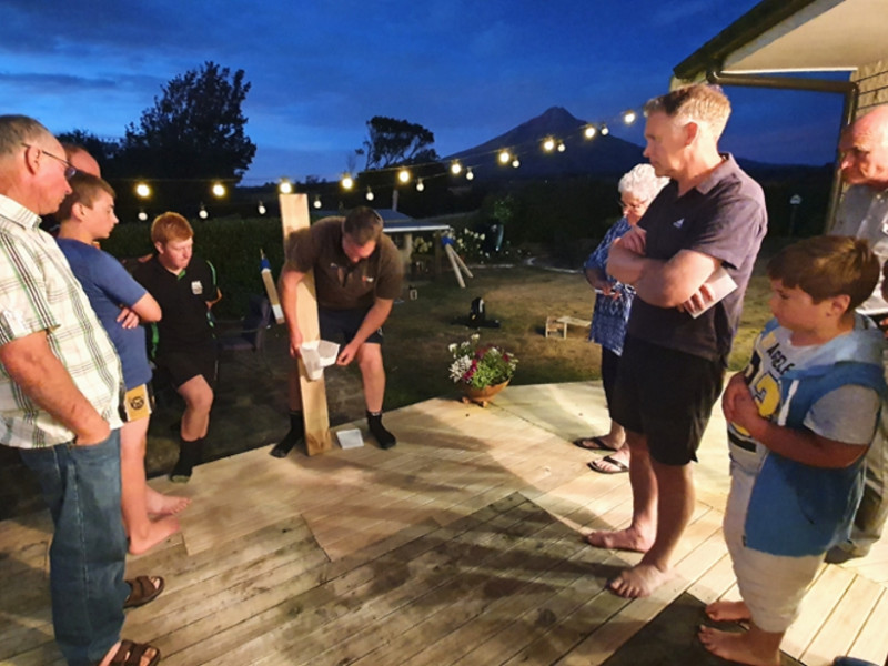 TRC staff demonstrating trap operation at Cram Farm community gathering