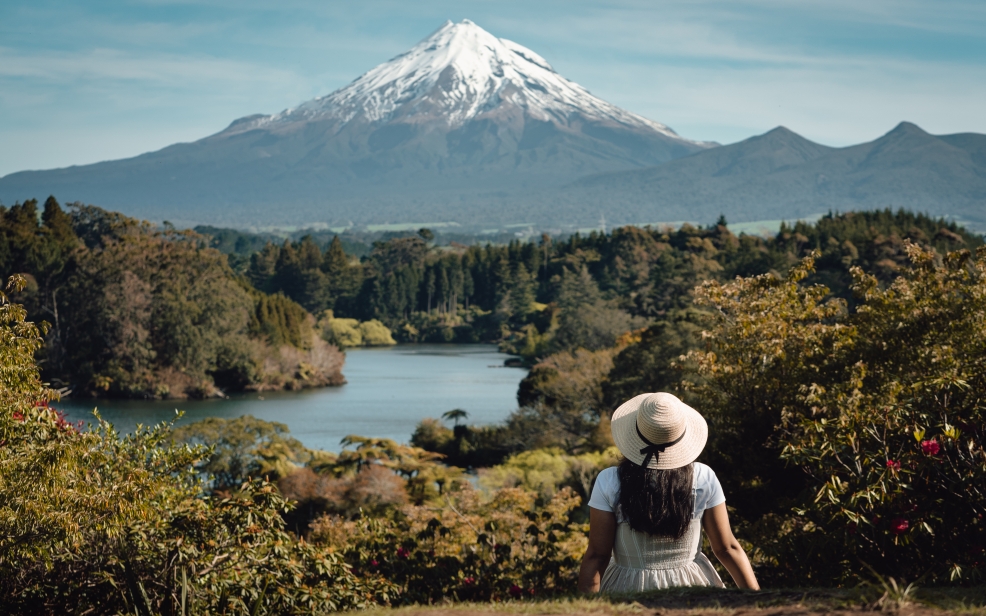 Mt Taranaki from Lake Mangamahoe with tourist in foreground 123rf web